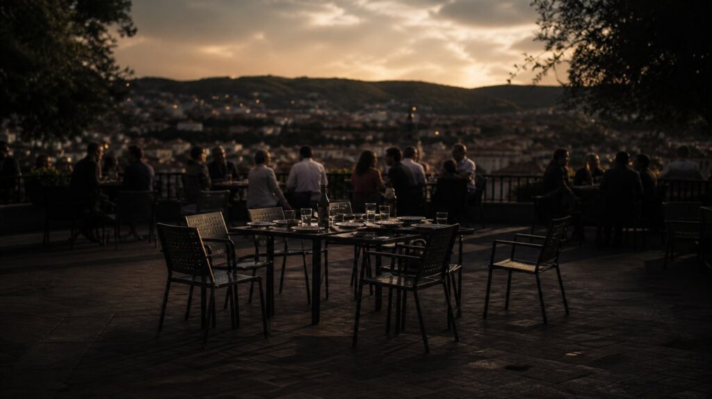Crowded neighbourhood restaurant terrace at dusk, half the tables abruptly empty, chairs pushed back, plates left mid-meal